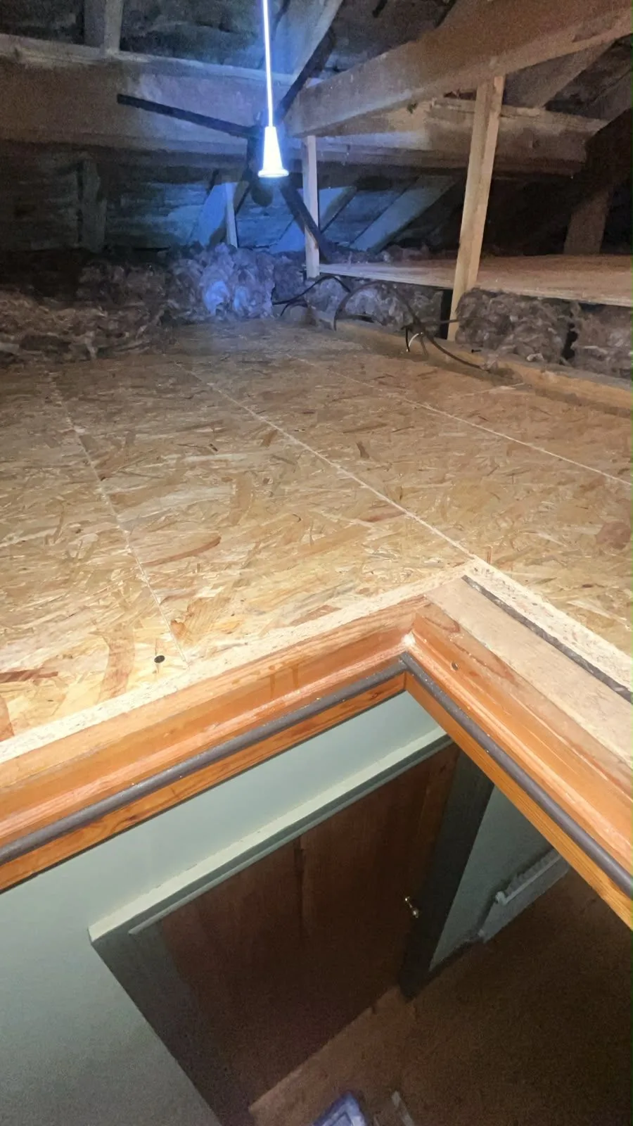 The finished boarded loft floor around the hatch opening in Nottingham